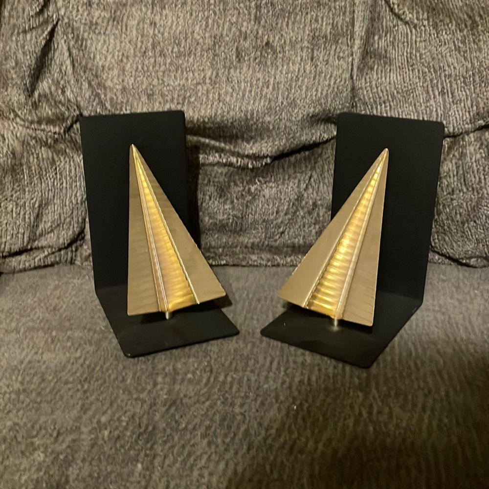 gold and black paper airplane bookend set